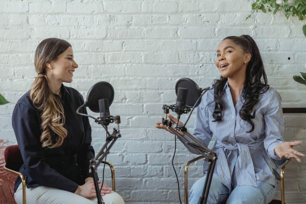 Two females podcasting